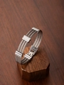 Detailed close-up of a triple-strand stainless steel cable bracelet with polished clasps - Silver