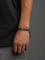 Adjustable black beaded bracelet featuring a silver zircon crown charm for women - Black