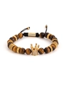 Macro shot of tiger eye beads with a gold crown charm and zircon inlay detail - Brown Tiger Eye (slbz019 Yellow)