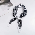 Polka dot and grid pattern black and white skinny silk scarf tied in a bow - Black