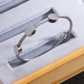 Silver twisted stainless steel cable bracelet with three polished circular discs - Steel