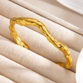 Irregular C-shaped open bangle with molten lava texture in 18k gold-plated finish - Gold