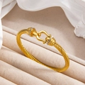 Bracciale a corda intrecciata dorata con chiusura a ferro di cavallo e cristalli - Oro
