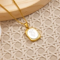 Golden flower rectangle pendant necklace with white inlay and detailed floral patterns - February