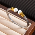 Adjustable two-tone twisted cable bracelet with white pearls in 18k gold finish - Two-Tone Silver Gold Bangle