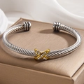 Bracciale a cavo d'argento con incrocio a X dorato e piccoli cristalli incastonati - Bicolore (Oro e Argento)