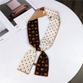 Narrow silk scarf with red polka dots and orange cat pattern on a white table - Dark Brown Khaki Cat & Fish