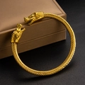 Gold wolf head twisted cable cuff bracelet with Nordic Viking style on jewelry box - Wolf Head Design (szgss153) / Gold