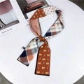 Polyester long scarf with orange cat print and polka dots shown on a white display - Orange Pink Cat & Fish