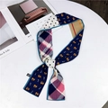 Polyester twilly scarf featuring cat prints and polka dots on a white tabletop - Blue Khaki Cat & Fish
