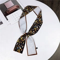 Long silk ribbon scarf with abstract blue and yellow patterns on a dark base - Figure Frame Black & White
