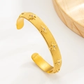Bracciale rigido in acciaio PVD dorato con trama a coste e stelle incastonate di zirconi - Oro