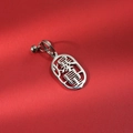 Macro view of silver 304 stainless steel 'Get Rich' pendant with a small bell - Success