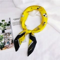 Detail of a bright yellow silk scarf with black and white cat patterns and polka dot edges - Sketch Cat Yellow (15)
