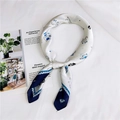 Detailed view of white silk scarf with blue cartoon cat prints and dotted navy border - Sketch Cat Blue (17)