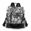 Women's black and white floral nylon backpack with golden hardware and leather detail - Black