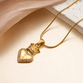 18k gold heart pendant necklace with crown detail and T-letter engraving in snake chain - Letter T