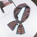 Classic colorful houndstooth pattern skinny silk scarf tied on white table - Houndstooth Blue Edge