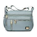 Dusty blue oxford cloth shoulder bag with multiple gold zippers and adjustable strap - Light Green