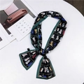 Narrow silk scarf with cartoon cat print, black base and green border on table - Army Green Cat (13)