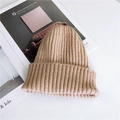Thick ribbed knit khaki beanie in a rolled cuff style for winter warmth and comfort - Adjustable / Apricot