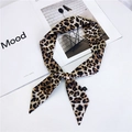 Classic brown leopard print skinny silk scarf tied as a stylish bag handle twilly wrap - Large Yellow Leopard