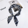 Black and white leopard print silk scarf tied in a bow with fashion magazine on white background - Large Black Leopard