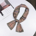 Classic houndstooth skinny silk scarf with orange and blue accents tied in a knot - Houndstooth Grey Edge