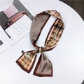 Brown houndstooth and geometric silk twilly scarf with satin finish on white table - Brown Geometric