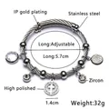 Zilveren roestvrijstalen kabelarmband met hol kruis en fonkelende zirkoon bedeltjes - Staaldraad Stijl / Staalkleur