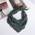 Blue leopard print satin neckerchief featuring a stylish knot on a fashion magazine - 1X Dense Leopard Lake Blue