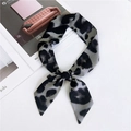 Gray and black leopard print skinny silk scarf tied in a bow with satin finish - Amur Leopard Gray