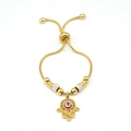 Bracciale regolabile dorato con mano di Fatima, malocchio e ciondoli in strass - Oro Occhi Rossi