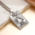 Silver Tarot The Tower pendant on a Cuban chain over a marble surface - The Tower (Steel)