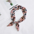 Detail of pink floral silk scarf tied in a bow on a stylish magazine background - Pink Small Floral