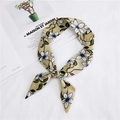 Detail of floral chiffon scarf tied on a magazine, showing silky texture and pattern - Beige Small Floral