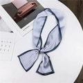 Navy and white vertical striped skinny silk scarf tied in a stylish knot on white surface - Blue Vertical Stripe