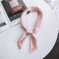 Solid light pink satin silk square scarf tied in a soft knot for a stylish neck accessory - 70cmx70cm / Pink