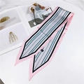 Pink and blue striped twilly silk scarf laid elegantly on a minimalist background - Stripe Pink Blue