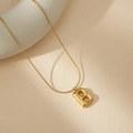 Macro view of 18K gold puffy letter B pendant on a sleek snake chain necklace - B With Snake Chain
