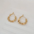 Detailed view of gold beaded hoop earrings with a chic French lever-back design - Gold