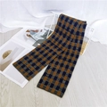 Thick checkered long scarf in deep brown and navy blue pattern on a basket - Navy Blue Geometric
