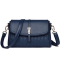 Detail of navy blue crossbody bag with rhombus embossed pattern and gold buckle - Dark Blue