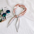 Detail of pink and grey striped silk scarf styled with sunglasses for a chic fashion look - Pink Varied Stripes