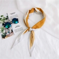 Detail of yellow and white striped silk neckerchief styled with sunglasses on a white background - Orange Varied Stripes