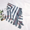 Detail view of a striped silk square scarf with modern Project Urban Street text print - Alphabet Maze