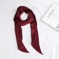 Detailed view of elegant wine red narrow silk scarf with smooth satin finish on white background - Burgundy