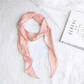 Flat lay of pink satin scarf on white cloth with magazine, ideal for styling - Pink