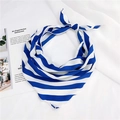 Detailed view of a knotted blue and white striped silk scarf on a white textile background - Blue White Stripe