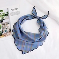 Detailed close-up of blue plaid silk scarf featuring delicate wave-stitched wavy edges - Blue Line Grid